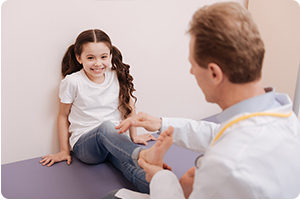 Experienced pediatric podiatrist examining a young patient in IL.